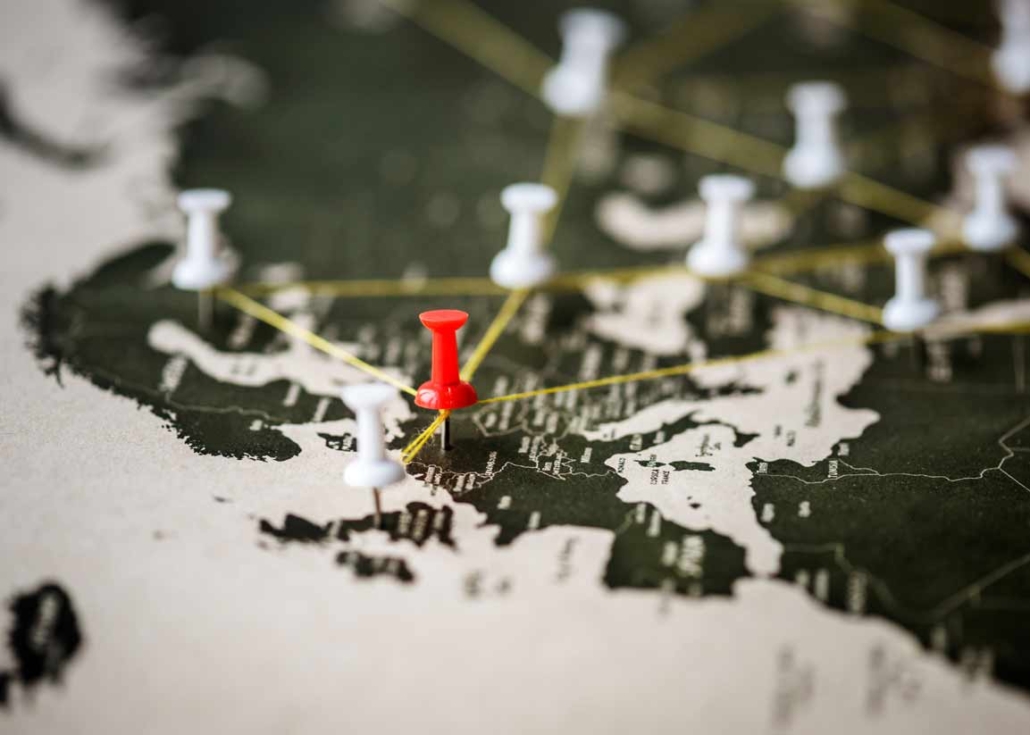 Closeup of pins on world map journey travel